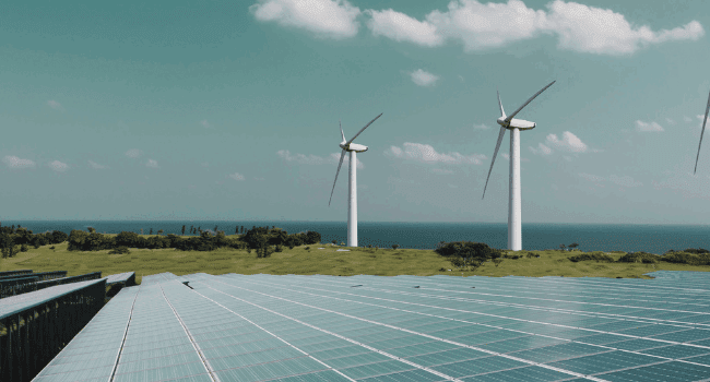Solar panels and wind turbines powering clean energy projects, supported by Navitas Resourcing Group’s renewable energy recruitment expertise.