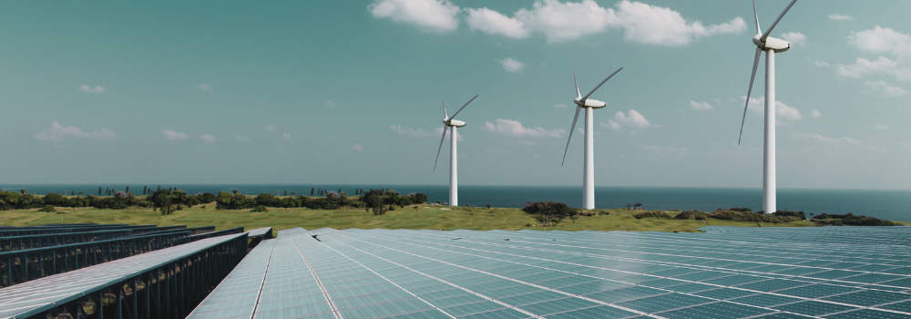 Solar panels and wind turbines powering clean energy projects, supported by Navitas Resourcing Group’s renewable energy recruitment expertise.