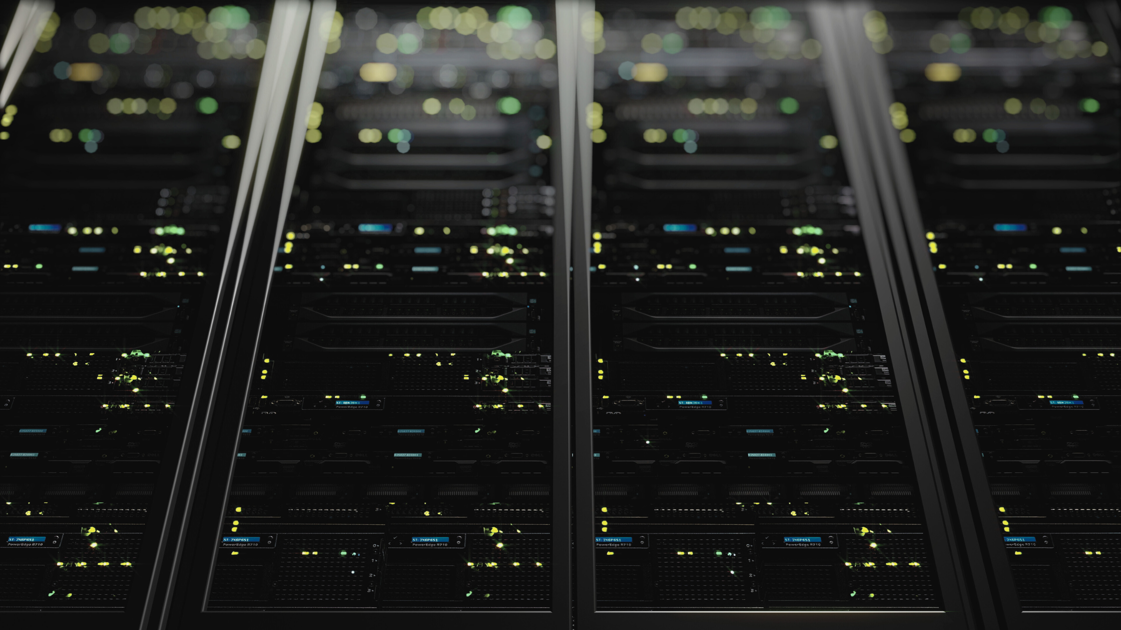 Rows of illuminated data centre servers representing the growing energy demand and shift towards on-site solar power solutions.