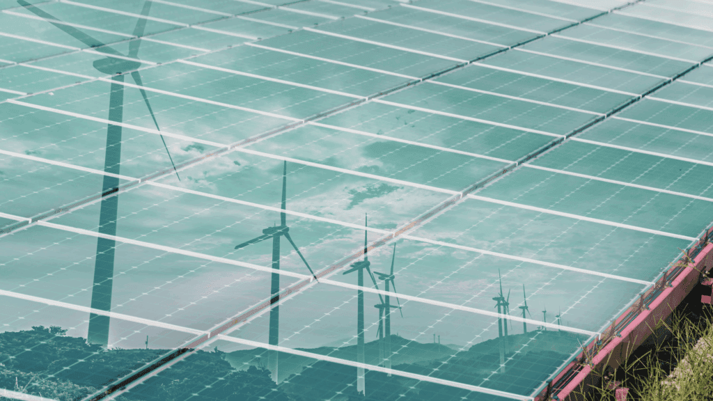 Solar panels overlaid with wind turbines, symbolising clean energy infrastructure and the sectors Navitas Resourcing Group supports through specialist recruitment.