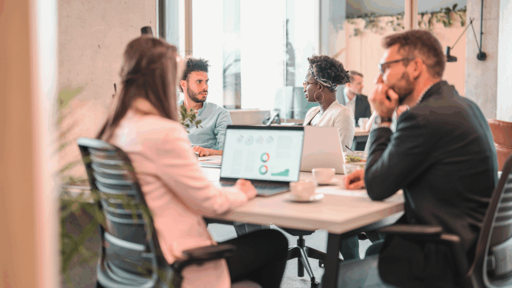 A team of renewable energy recruitment specialists discussing hiring strategies in a modern office environment.