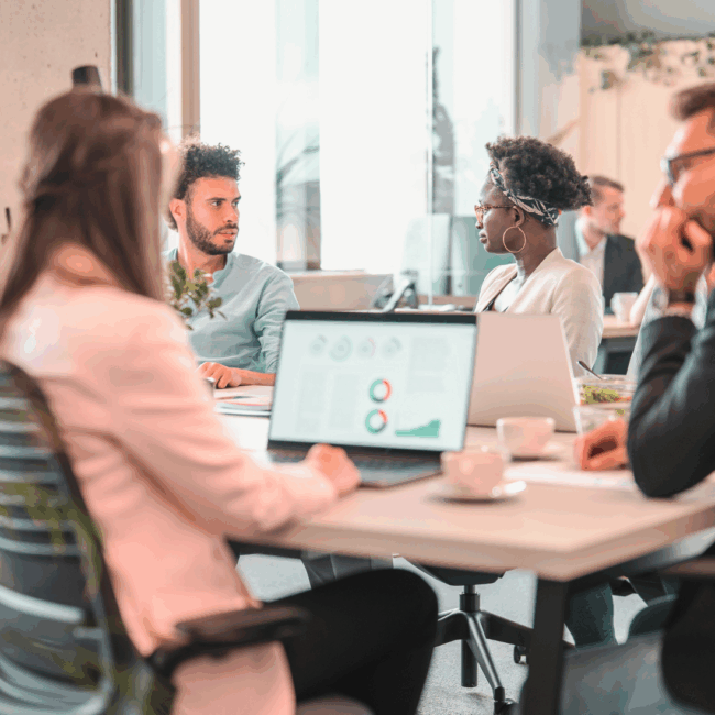 A team of renewable energy recruitment specialists discussing hiring strategies in a modern office environment.