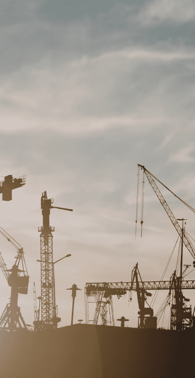 Construction cranes working on large-scale infrastructure projects in Europe, representing growth in data centre construction and digital infrastructure development