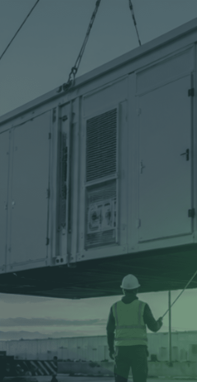 Crane installing a prefabricated modular data centre unit at a Mission Critical infrastructure site, demonstrating how modular construction is helping accelerate data centre delivery.