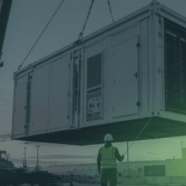 Crane installing a prefabricated modular data centre unit at a Mission Critical infrastructure site, demonstrating how modular construction is helping accelerate data centre delivery.