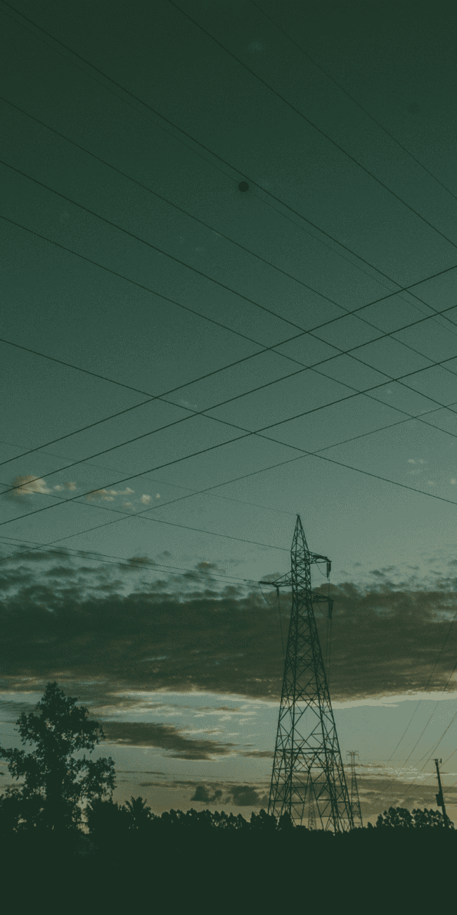 Electricity transmission pylons and power lines representing UK grid connections and renewable energy infrastructure.